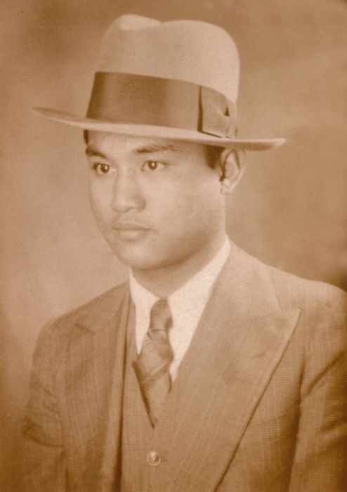 estanislao martinez in a suit and hat
